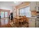 Bright dining area with wood table and rug near kitchen at 121 Westview Dr # 106, Carrboro, NC 27510