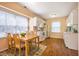 Bright kitchen with white appliances and adjacent dining area with hardwood floors at 121 Westview Dr # 106, Carrboro, NC 27510