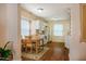 Bright kitchen and dining area with white cabinets, wood floors, and natural light from a large window at 121 Westview Dr # 106, Carrboro, NC 27510