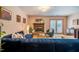 Open living room with blue sofa and fireplace, creating a welcoming and comfortable space for relaxation at 121 Westview Dr # 106, Carrboro, NC 27510