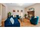 Inviting living room featuring a plush blue sectional sofa and a cozy fireplace with a brick hearth at 121 Westview Dr # 106, Carrboro, NC 27510