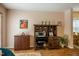 Well-lit home office with a wooden desk and shelving unit offering ample storage space at 121 Westview Dr # 106, Carrboro, NC 27510
