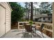 Outdoor patio with a table and chairs, perfect for relaxing or entertaining with nature views at 121 Westview Dr # 106, Carrboro, NC 27510