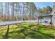 Spacious backyard with well-maintained lawn, privacy fence, and outdoor dining area at 124 Kipling Dr, Oxford, NC 27565