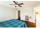 Bright bedroom with hardwood floors and a ceiling fan creates a comfortable atmosphere at 124 Kipling Dr, Oxford, NC 27565