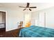 Cozy bedroom features ceiling fan, dresser, closet and a view into the bathroom at 124 Kipling Dr, Oxford, NC 27565
