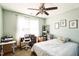 Cozy bedroom with large window, ceiling fan, and neutral color scheme at 124 Kipling Dr, Oxford, NC 27565