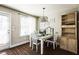 Breakfast area, with a table and a hutch next to a door and windows at 124 Kipling Dr, Oxford, NC 27565