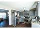 Well-lit kitchen featuring stainless steel appliances, gray cabinets, and granite countertops at 124 Kipling Dr, Oxford, NC 27565