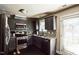 Modern kitchen boasts sleek countertops, stainless steel appliances, and stylish backsplash at 124 Kipling Dr, Oxford, NC 27565