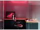 Gaming room featuring a wooden desk, gaming chair and a neon sneaker sign at 1421 Sky Vista Way, Raleigh, NC 27613