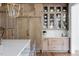 Custom kitchen cabinetry and a full sized integrated refrigerator create a sleek and functional design at 1421 Sky Vista Way, Raleigh, NC 27613