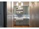Charming kitchen features painted cabinets, farmhouse sink, and modern lighting, blending classic and contemporary styles at 1421 Sky Vista Way, Raleigh, NC 27613