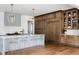 Beautiful kitchen highlighting a large center island, custom wood cabinets, and stainless steel appliances, perfect for entertaining at 1421 Sky Vista Way, Raleigh, NC 27613