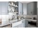 Cozy kitchen showcasing custom cabinets, a stylish farmhouse sink, and elegant countertop finishes at 1421 Sky Vista Way, Raleigh, NC 27613