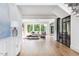 Open-concept living room with hardwood floors and views of the backyard at 1421 Sky Vista Way, Raleigh, NC 27613