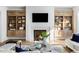 Cozy living room with a fireplace and built-in shelving at 1421 Sky Vista Way, Raleigh, NC 27613