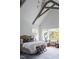 Bright and airy main bedroom features vaulted ceilings, large windows, and comfortable seating area at 1421 Sky Vista Way, Raleigh, NC 27613