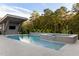 Stunning pool area with a spa, water features, and a covered outdoor entertaining space at 1421 Sky Vista Way, Raleigh, NC 27613