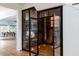 Modern wine cellar featuring glass doors and wine racks at 1421 Sky Vista Way, Raleigh, NC 27613
