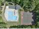 Aerial view of a community pool and tennis courts surrounded by trees at 1425 Princess Anne Rd, Cary, NC 27607