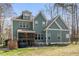Green home featuring screened porch, grill, and backyard at 1425 Princess Anne Rd, Cary, NC 27607