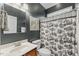 Cozy bathroom featuring a pedestal sink, patterned shower curtain, and dark gray walls at 1425 Princess Anne Rd, Cary, NC 27607