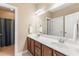 Bathroom featuring a double vanity with tile floors and a shower with curtain at 1425 Princess Anne Rd, Cary, NC 27607