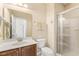 Well-lit bathroom with a walk-in shower, single vanity, and neutral decor at 1425 Princess Anne Rd, Cary, NC 27607