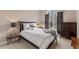 Comfortable bedroom with a queen-sized bed, large window, and dark wood accents for a relaxing ambiance at 1425 Princess Anne Rd, Cary, NC 27607