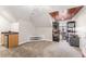 Large bonus room with mini-fridge, storage, and wood ceiling accent at 1425 Princess Anne Rd, Cary, NC 27607