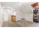 Bonus room with storage, wood ceiling accent, and a mini-fridge at 1425 Princess Anne Rd, Cary, NC 27607