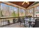 Cozy covered deck with wooden ceiling, patio furniture, and a view of the backyard at 1425 Princess Anne Rd, Cary, NC 27607