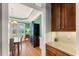 View from kitchen to dining room with green walls, hardwood floors, and butler's pantry at 1425 Princess Anne Rd, Cary, NC 27607
