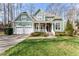 Beautiful two-story home with manicured lawn, two-car garage, and welcoming front porch at 1425 Princess Anne Rd, Cary, NC 27607