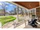 Cozy front porch with wood ceiling and rocking chairs at 1425 Princess Anne Rd, Cary, NC 27607