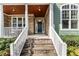 A welcoming front porch featuring stone steps and columns at 1425 Princess Anne Rd, Cary, NC 27607
