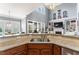 Kitchen with granite counters, stainless steel appliances, and view of living room with fireplace at 1425 Princess Anne Rd, Cary, NC 27607