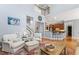 Comfortable living room offering seamless flow to kitchen, bar seating, and upper level at 1425 Princess Anne Rd, Cary, NC 27607