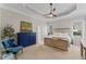 Spacious main bedroom with tray ceilings, generous natural light, and neutral carpeting at 1425 Princess Anne Rd, Cary, NC 27607
