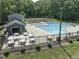 Community pool area with lounge chairs, tables, grills, and restrooms at 1425 Princess Anne Rd, Cary, NC 27607