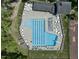 Aerial view of a community pool with lounge chairs and tables at 1425 Princess Anne Rd, Cary, NC 27607