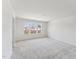 Bright bedroom with plush carpet and abundant natural light from large windows at 1426 Cooper St, Sanford, NC 27330