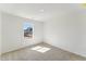 Inviting bedroom with neutral carpet and paint, illuminated by a window that offers natural light at 1426 Cooper St, Sanford, NC 27330