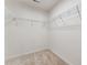 Walk-in closet with wall mounted shelving to keep clothes and accessories organized and accessible at 1426 Cooper St, Sanford, NC 27330