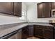 Well-designed kitchen showcasing granite countertops, stainless appliances, and ample cabinet space at 1426 Cooper St, Sanford, NC 27330