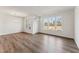 Spacious living room boasts large windows and wood-style flooring for a modern look at 1426 Cooper St, Sanford, NC 27330