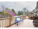 Back deck featuring a blue bench with pillows and a wooden railing at 1426 N Roxboro St, Durham, NC 27701