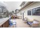 Back deck featuring a blue bench and seating with a wooden railing at 1426 N Roxboro St, Durham, NC 27701