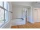 Bright bathroom featuring a classic tub with decorative tile and hardwood floors at 1426 N Roxboro St, Durham, NC 27701